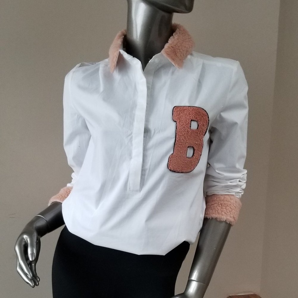 White shirt with pink furry trims
